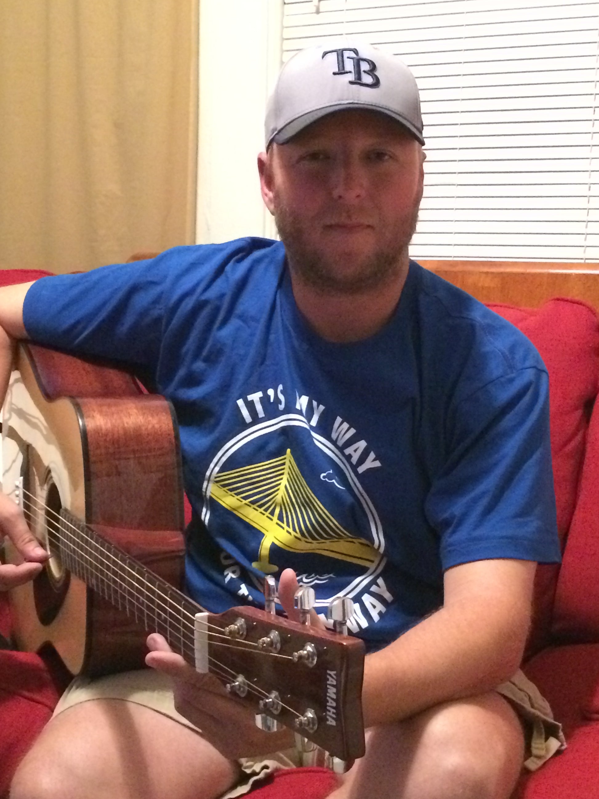 A guitar player wears an It's My Way or the Skyway shirt