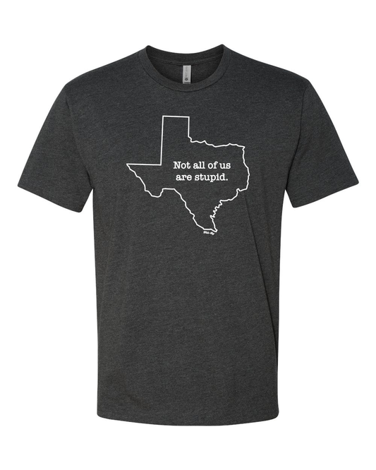 Heather charcoal t-shirt with white text reading 'Not All of Us are Stupid' and Texas state outline design